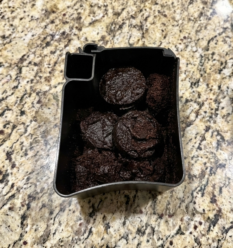 Oily coffee beans causing a mushy mess in the catch bin